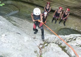 Small child climbing a rock during Canyoning in the Nefeli Canyon for Kids & Families from Active Nature Epirus.