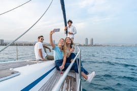 Group of friends enjoying the Sailing Boat Trip in Barcelona with Tapas from BDA Sailing Experience.