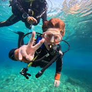 Person in their SSI Trial Dive for Beginners with the peace sign in Lloret de Mar from Dolphins Diving Center Lloret de Mar.