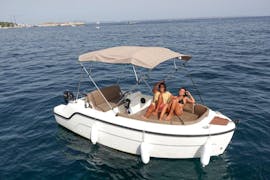 Two friends enjoy a Boat Rental in Pollença (up to 7 people) from Nautical Experience Pollença.