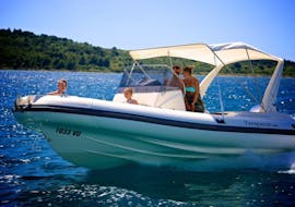 A family enjoys a Boat Rental in Pollença (up to 12  people) from Nautical Experience Pollença.