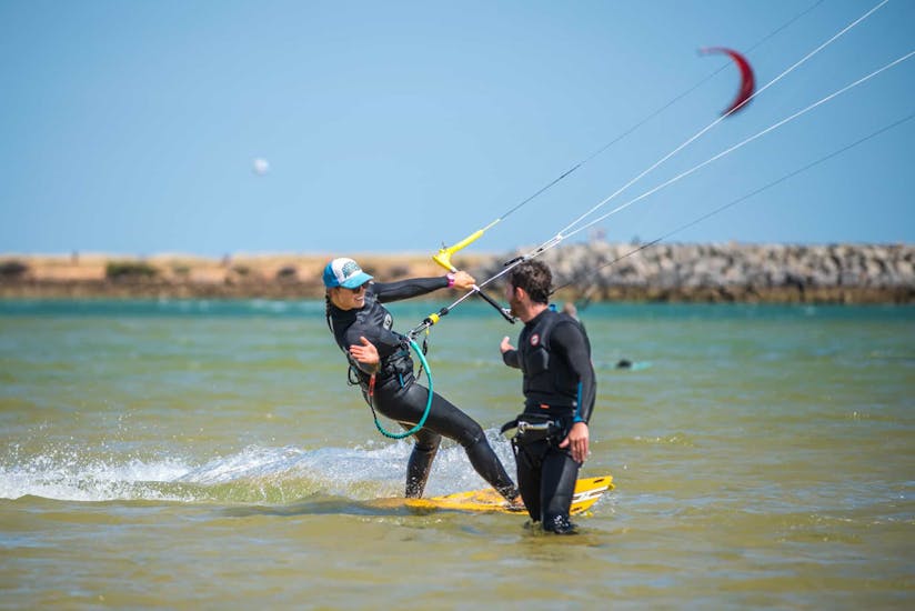 Somebody who is kitesurfing during the lessons organized by Algarve Watersports.
