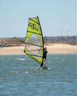 A person during the windsurfing lessons in Lagos organized by Algarve Watersports.