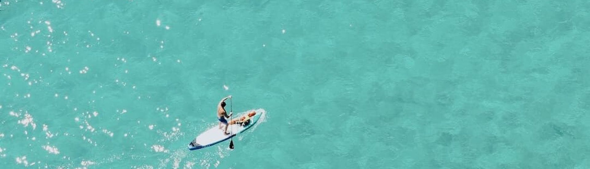 SUP rental in clear and blue Cala Figuera with Redstar Tours.