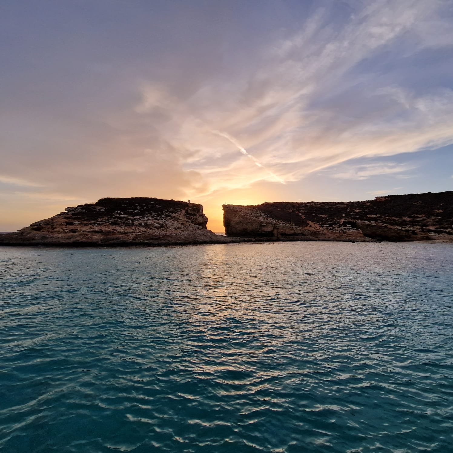 The Sunset during the Sunset Boat Trip to the Blue Lagoon with Swimming from Mitzi Tours Malta.