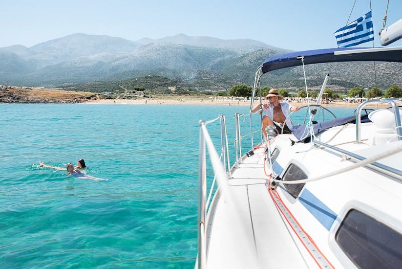 A group is enjoying the crystal clear water while doing the Boat Trip to Stalis & Chersonissos with Lunch & Swimming Stops organized by Malia Yachting.