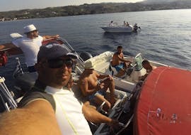 A man taking a selfie on the boat during the Boat Rental in Halkidiki (up to 9 people) with License from Blue Secret Boats Halkidiki.