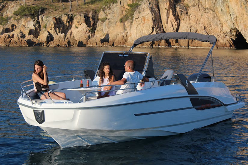 White Boat Rental in a serene scene with people in Palamós with License (up to 10 people) from Palamós Boats.