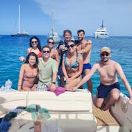 Group of friends posing for a photo after having enjoyed a catamaran trip with Blue Charter Ibiza.