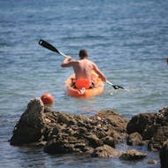A guy during theSea Kayak Hire at the Alykes Potamos Beach in Corfu from Corfu Surf Club.