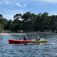 Photo of two people during a sea kayaking tour with snorkeling from Korčula Town from Korkyra Info.