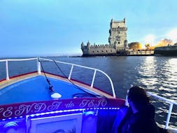 The front of the boat and the Belem Tower in the background during the Private Boat Trip on the Tagus River along Lisbon's coastline with Fado Music from Lisbon Boats.
