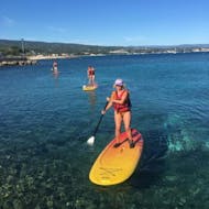 Women during their SUP Hire in the Calanques of La Ciotat from ExpéNature Côte d'Azur.