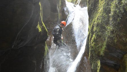 Man jumping during his session of Canyoning in the Canyon du Grenant for Beginners from Terra Nova Canyoning.