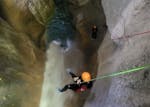 Person abseiling during his session of Canyoning in the Canyon de L'Infernet from Terra Nova Canyoning.