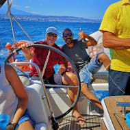 Tour in barca a vela all'area marina protetta Isole Ciclopi con pranzo con Sicilian Sail Catania.