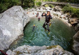 Man jumps off rocks while canyoning in Zemmschlucht - Blue Lagoon Tour with Mountain Sports Mayrhofen.