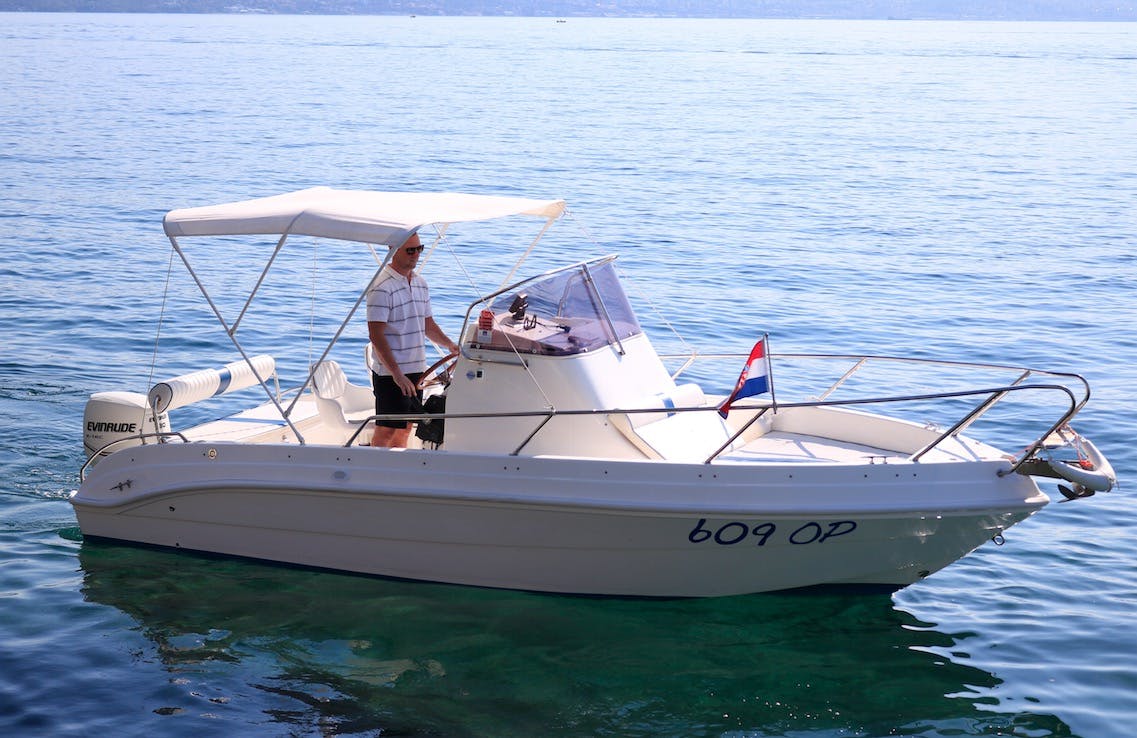 Man enjoying a licensed boat charter in Opatija (up to 7 persons) with Opatija Adventure.