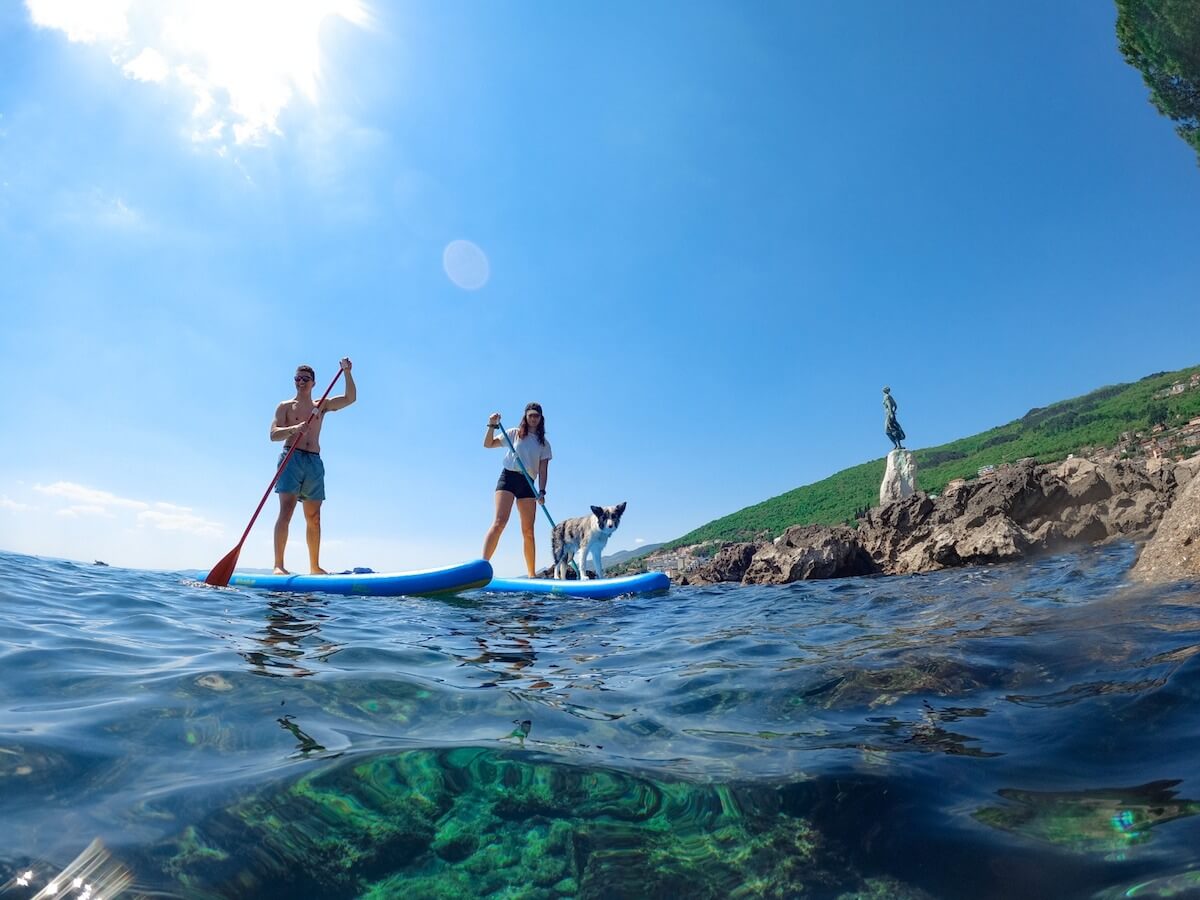 Group of friends enjoying the Stand Up Paddle Boarding Morning Tour along Opatija from Opatija Adventure.