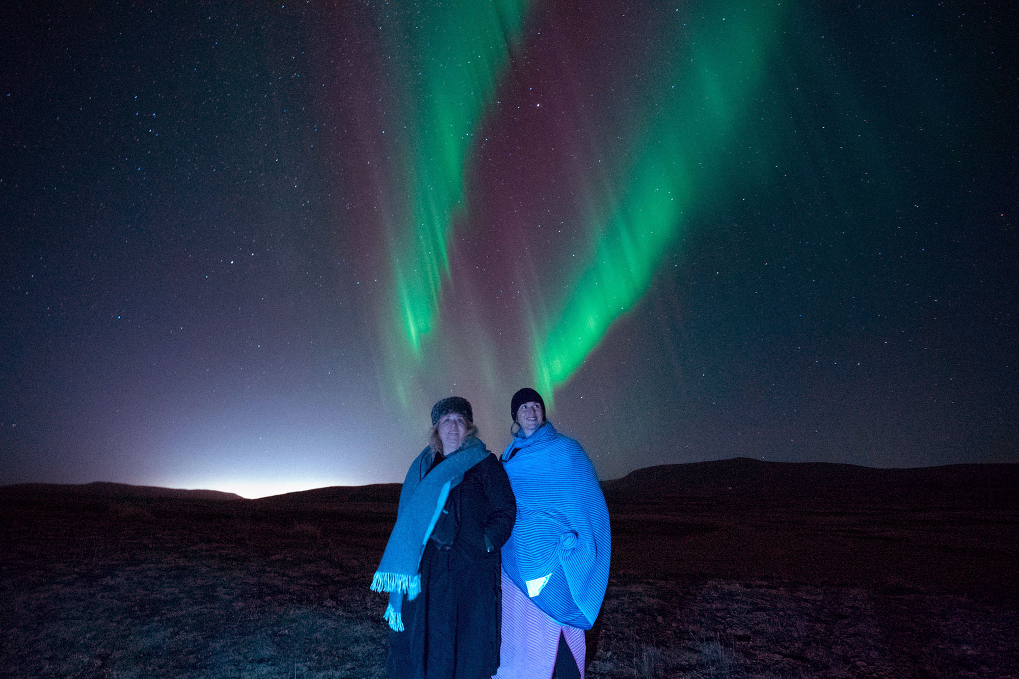 Northern Lights Off-Road Bus Tour with Pastries, Hot Chocolate & Photos from Glaciers and Waterfalls Iceland.