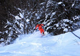 A skiers going through deep snow during Off-piste Skiing Lessons for All Levels with Ski School Mittelberg.