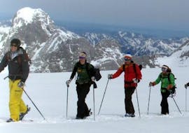 The instructor and three participants enjoying the snow during their Private Ski Touring Guide for All Levels from Private Ski School Höll.