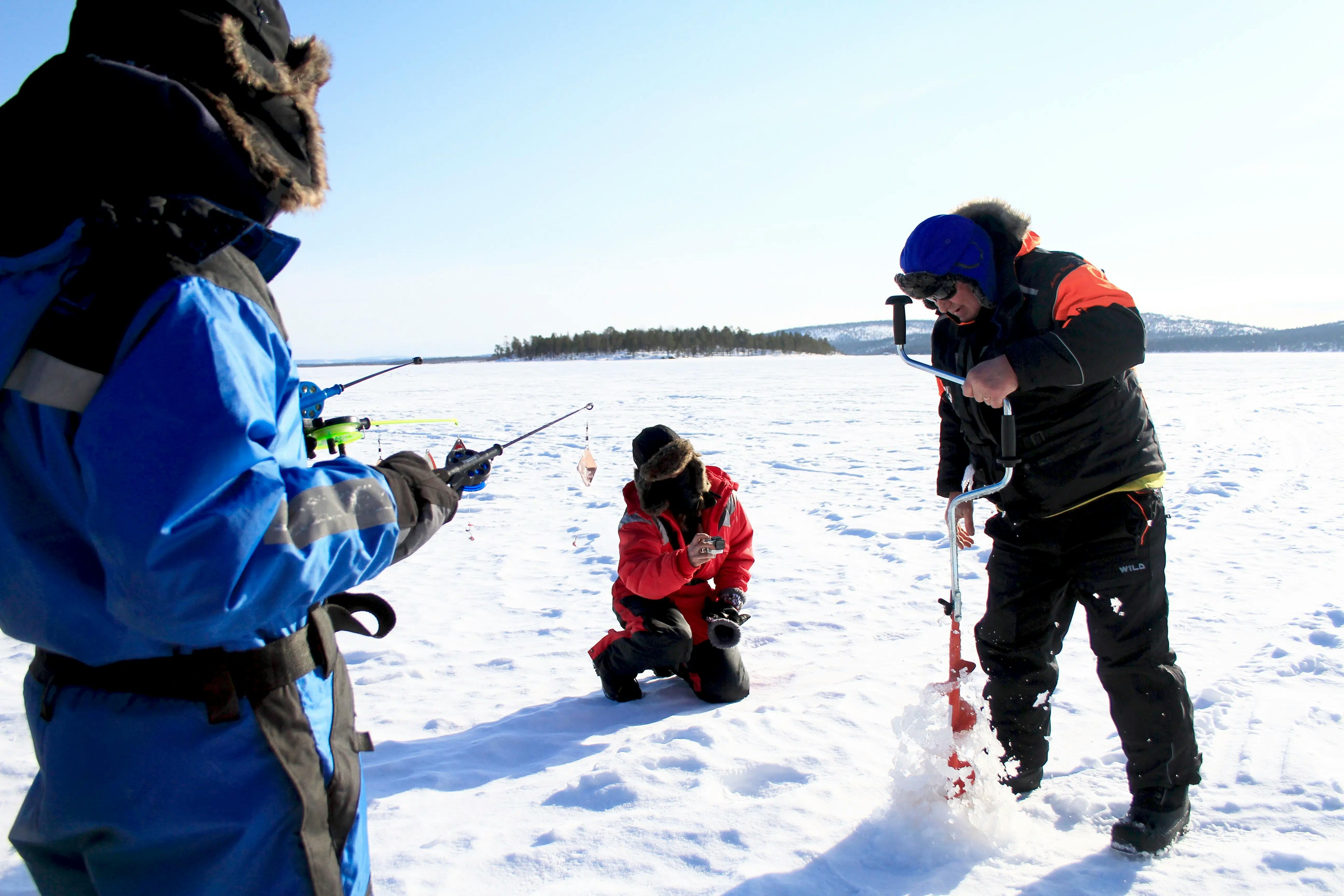Bus Tour from Kakslauttenen with Ice Fishing, Lunch & Reindeer Experience from Ivalo Safaris.