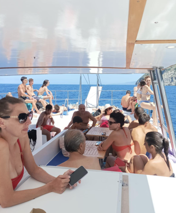 Sunset Catamaran Trip along Costa Viola with Swimming Stops from Foti Crociere Bagnara Calabra.