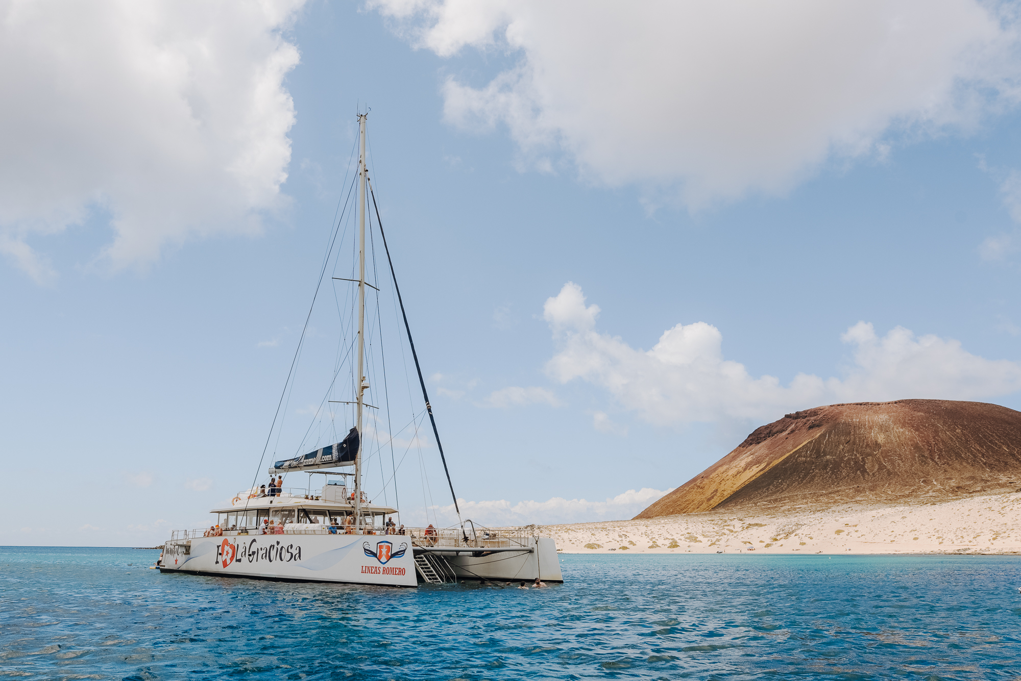 Catamaran Trip from Lanzarote to La Graciosa with Lunch, Open Bar & Pick-up.