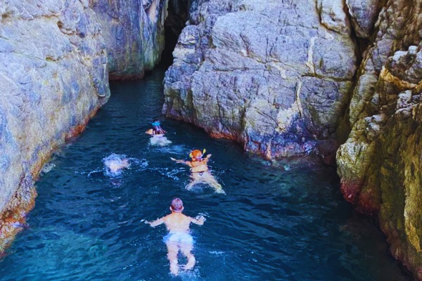 Boat Trip from Torre Faro to the Caves of Bagnara with Swimming Stops from Scilla in Barca.