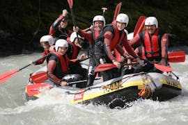A group of friends is having fun on a Rafting Daytrip on the Inn River through Imster Schlucht with Cankick Ötztal.