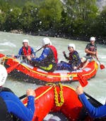 Water is splashing on the happy participants of the Rafting “Action” for Young & Old - Imster Schlucht with CanKick Ötztal.