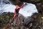A man abseiling while Canyoning in Lower Auerklamm - Ultimo Tour with feelfree Outdoor Professionals Ötztal.