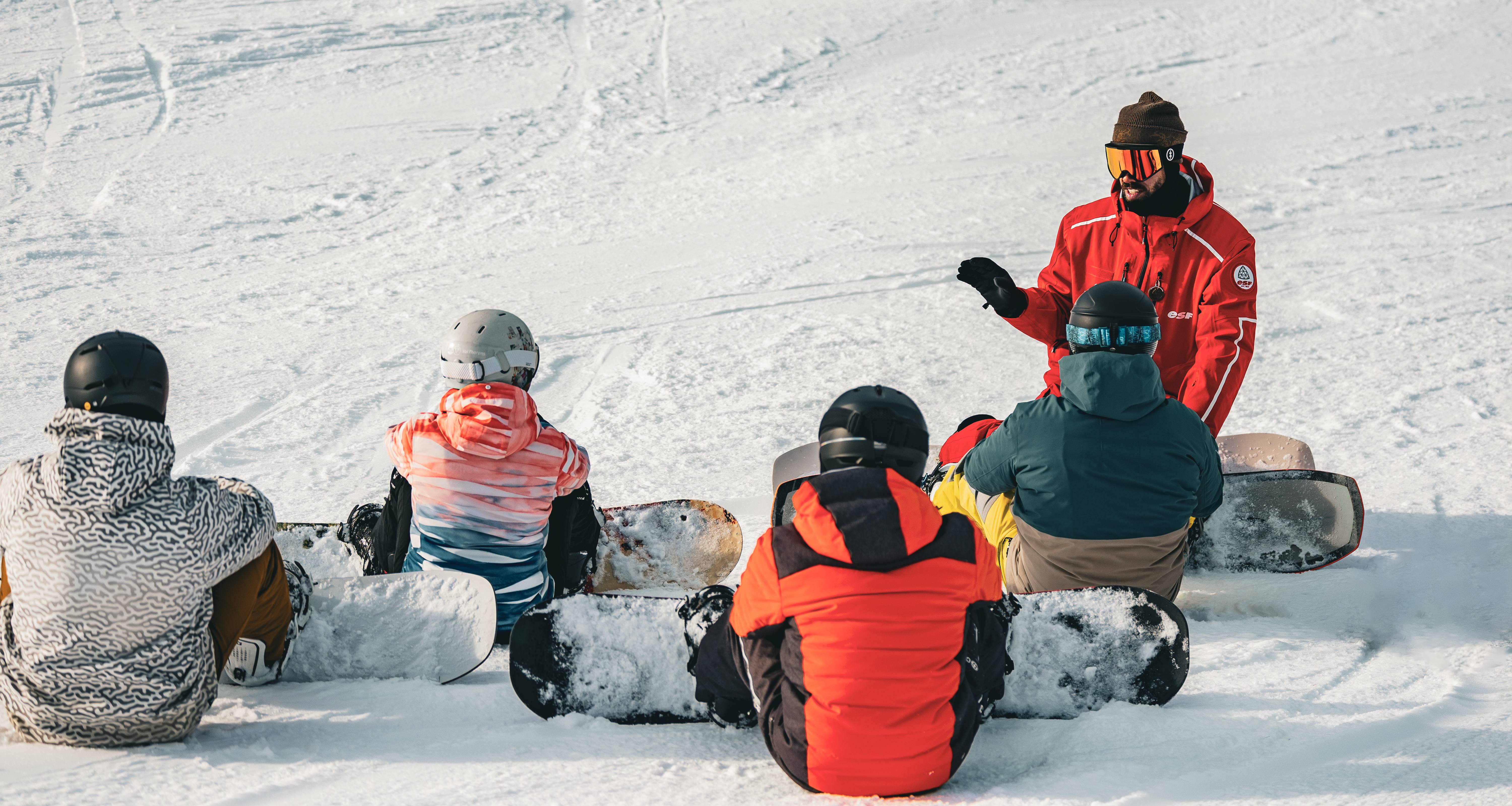 Clases de snowboard para adultos para todos los niveles con ESF Arc 1800.