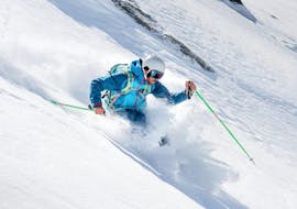 A skier is skiing in powder snow during his Off-Piste Skiing Lessons "Cool Mountain" with Ski Cool Val Thorens.