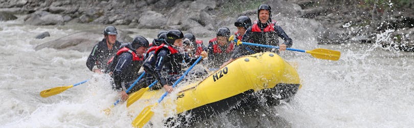 A boat fighting through the whitewater during the Rafting on the Inn River - Perfect Start with H2O Adventure Ried.