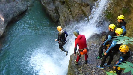 A man jumping into the water during Canyoning Level 1 - Easy Beginner Action in Reutte with MAP-Erlebnis Blaichach.