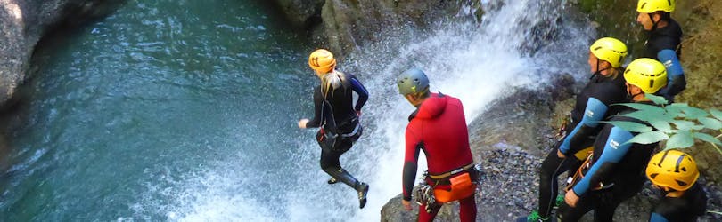 A man jumping into the water during Canyoning Level 1 - Easy Beginner Action in Reutte with MAP-Erlebnis Blaichach.