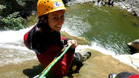 A woman abseiling during Fun Canyoning in Starzlachklamm from Sonthofen with Die Canyonauten Allgäu