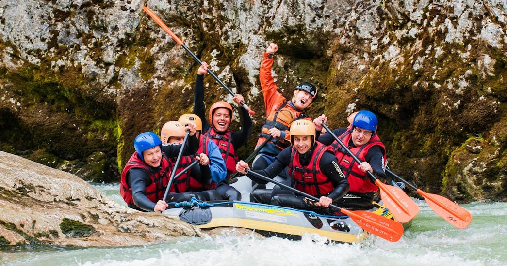 People in a rafting boat while Rafting on the Saalach River in Lofer - Classic 3 Tour with Motion Outdoor Center Lofer.