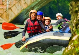 A family in a boat while Rafting on the Saalach River in Lofer for Kids & Families with Motion Outdoor Center Lofer.
