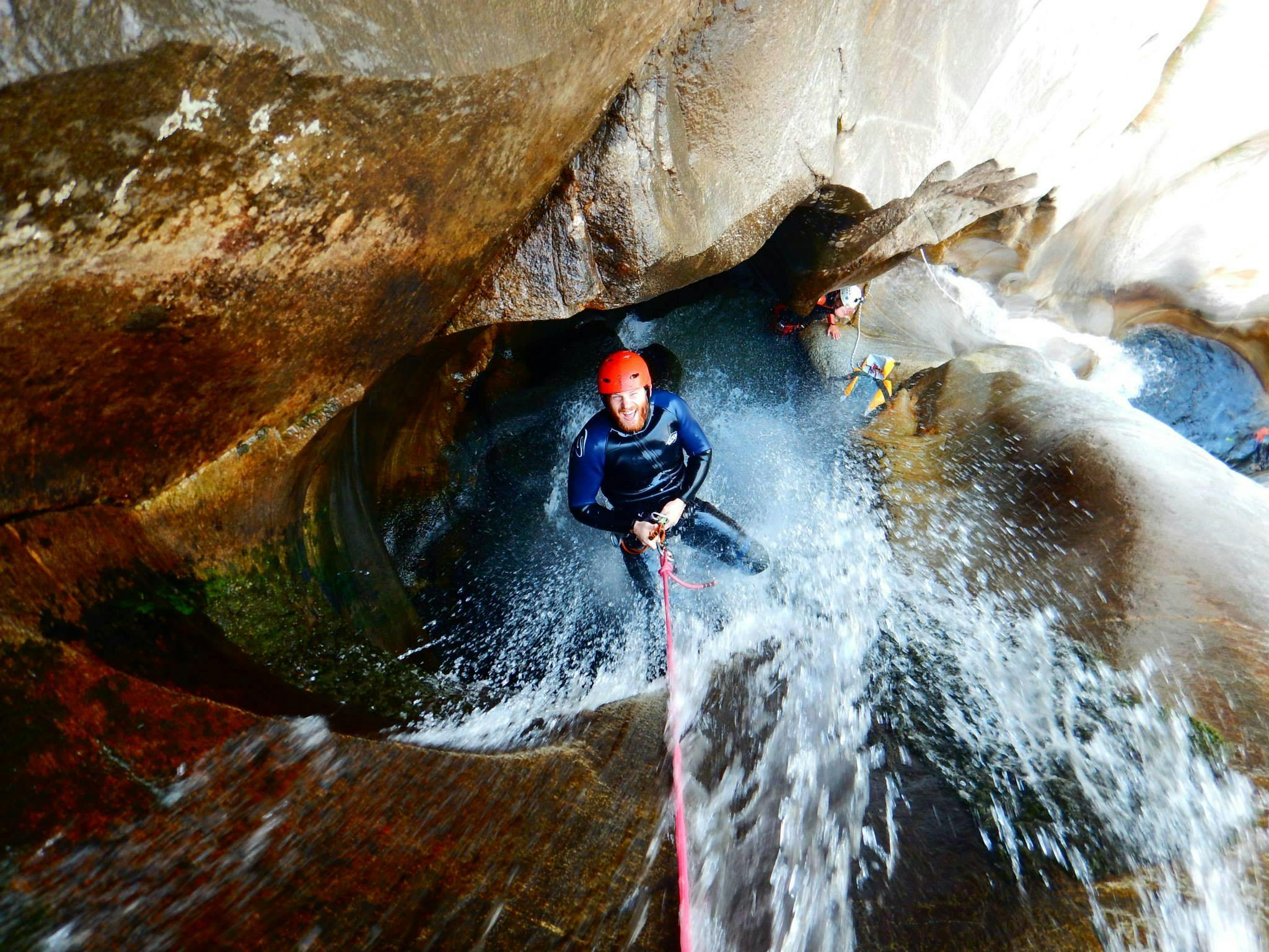 Canyoning in the Iragna Canyon in Ticino for Thrill Seekers from Swiss River Adventures Ruinaulta Picture of a man during his Canyoning in the Iragna Canyon in Ticino for Thrill Seekerswith Swiss River Adventures Ruinaulta.