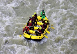 A rafting group gliding on the waves of Salzach river on their White-Water Rafting on the Salzach River with the experienced instructors of Frost Canyoning & Rafting Tours.