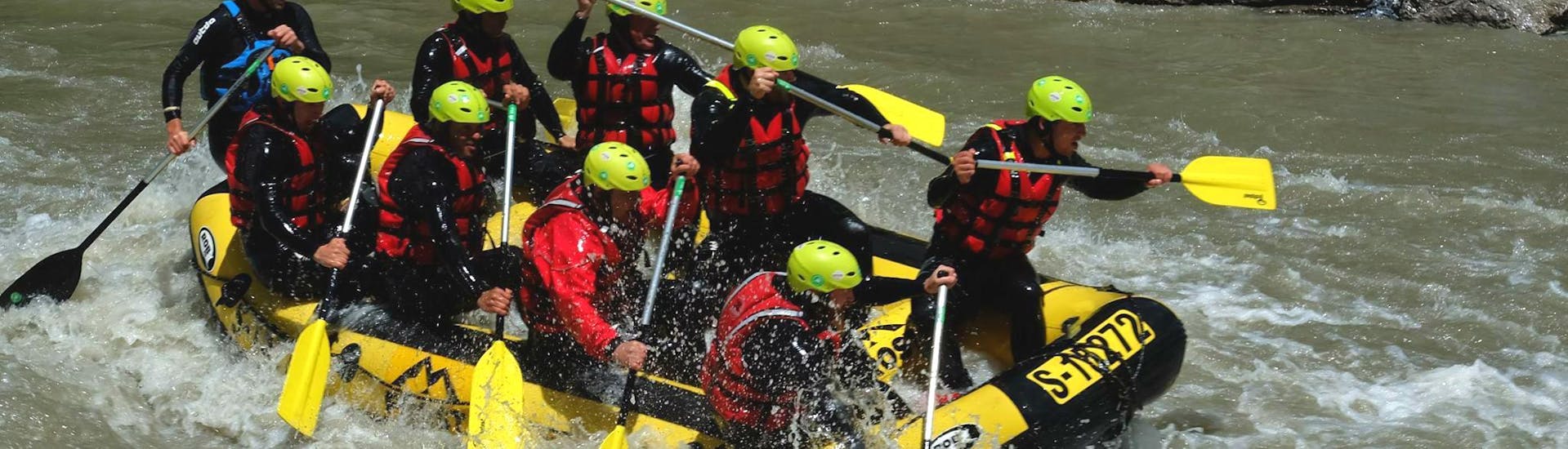A group of people proving full team spirit on their Rafting Tour with a Private Boat VIP on the Salzach with Frost Rafting & Canyoning Tours.