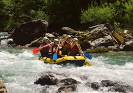 A group of people maneouvres the raft through some white water rapids during the Rafting on the Salza River in Palfau - Half Day Tour with Deep Roots Adventures Palfau.