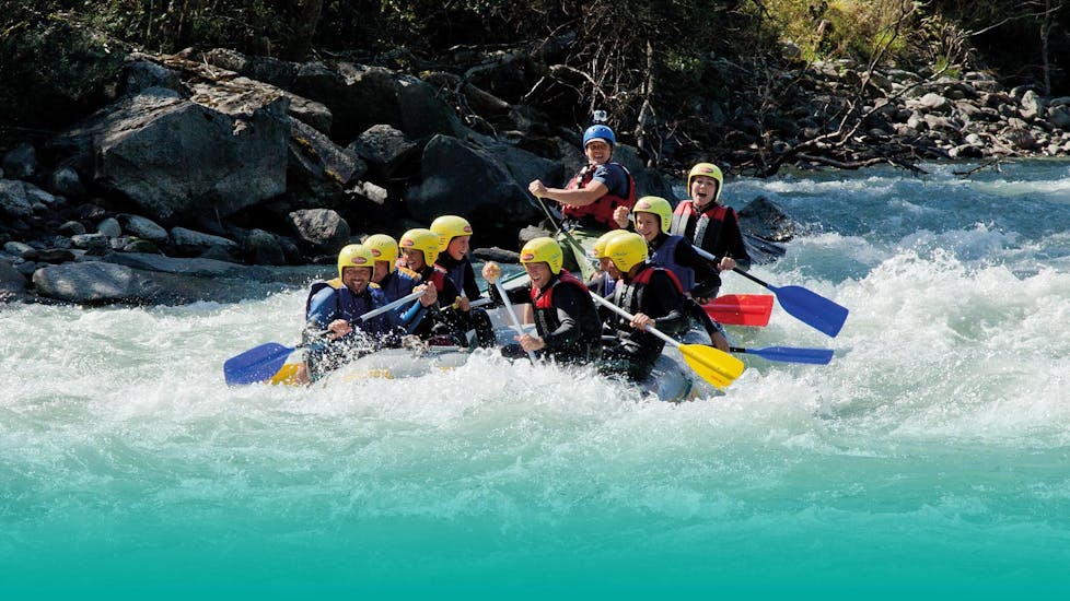 People in a bot while Rafting on the Isel River - First Step Tour  with Adventurepark Osttirol.