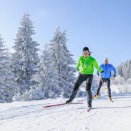 Two cross country skiers enjoying their Private Cross Country Skiing Lessons for All Levels from Active Snow Team Engelberg.