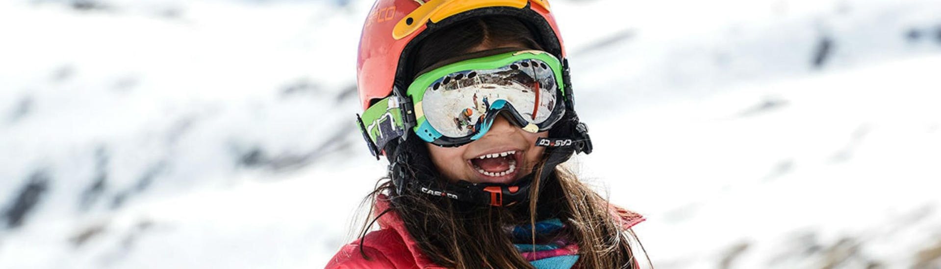 A young girl is laughing and seemingly enjoying herself during her Private Ski Lessons for Kids - High Season with the ski school Prosneige Méribel.