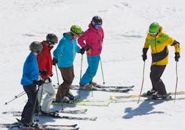 Ski instructor in front of his ski group 