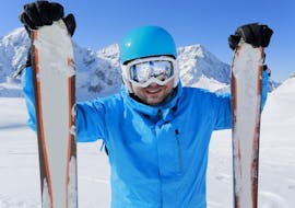 A man is smiling right before the beginning of his private ski lessons for adults - all levels in the Schneesportschule Black Forest Magic Feldberg.